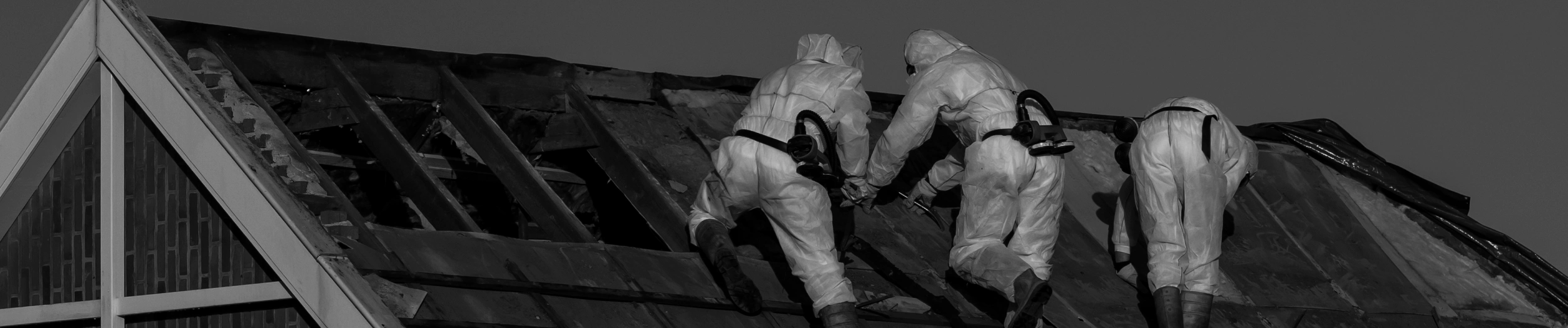 workers fixing asbestos on top of a roof glendale az